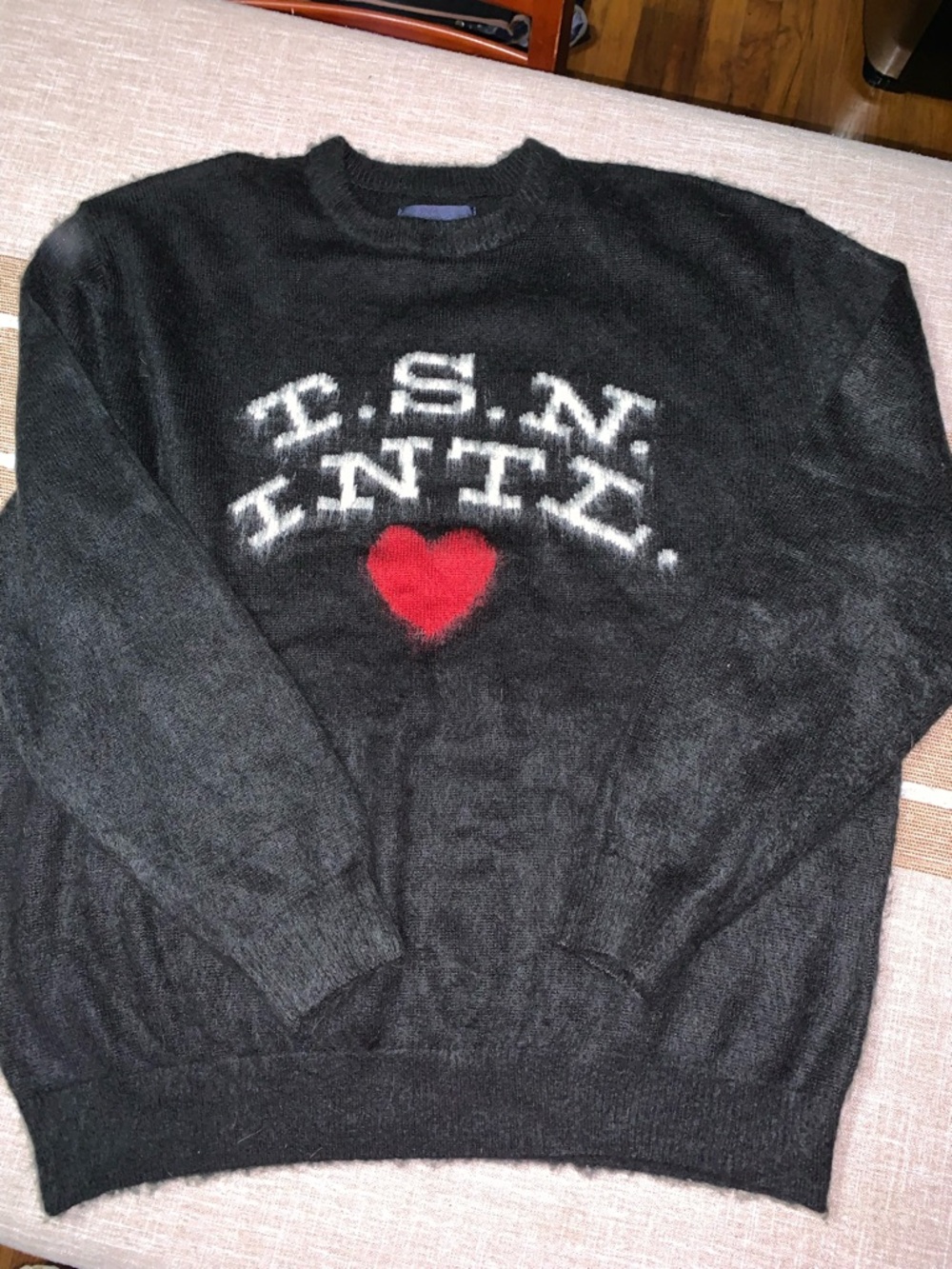 Black Crewneck Sweater with White Lettering and Red Heart Accent